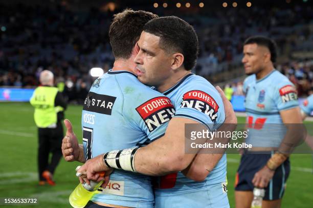 Mitchell Moses of the Blues and Cody Walker of the Blues celebrate after winning game three of the State of Origin series between New South Wales...