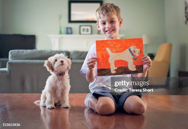 sitting with dog - kind dier stockfoto's en -beelden