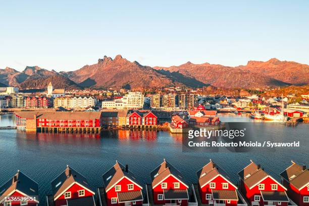 aerial view of traditional red rorbu at dawn - rorbu stock pictures, royalty-free photos & images
