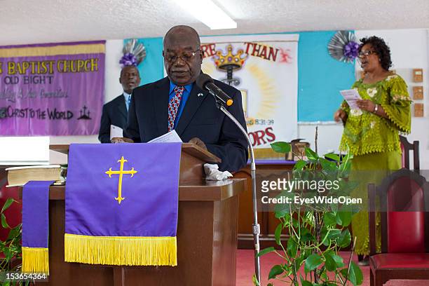 Father John is praying at the sunday service in the Zion Baptist Church in Old Bight on June 15, 2012 in Cat Island, The Bahamas.