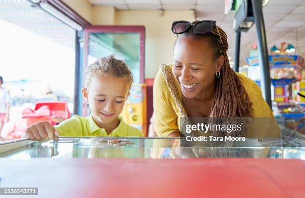 family fun at the arcade - children stock pictures, royalty-free photos & images