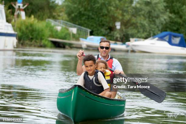 family canoe adventure - life jacket photos stock pictures, royalty-free photos & images