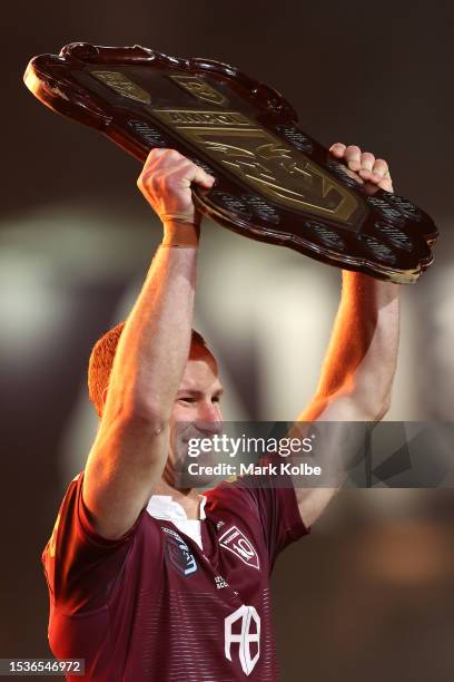 Daly Cherry-Evans of the Maroons holds aloft the State of Origin Shield after winning the series 2-1 after game three of the State of Origin series...