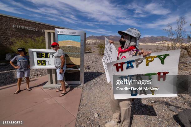 Activist Tom Comitta demonstrates at the unofficial thermometer at the Furnace Creek Visitor Center indicating a temperature of 131 degrees...