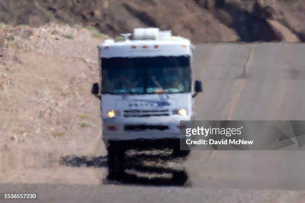 An RV shimmers in the heat haze as the temperature rises past about 127 degrees Fahrenheit on a day that could set a new world heat record in Death...