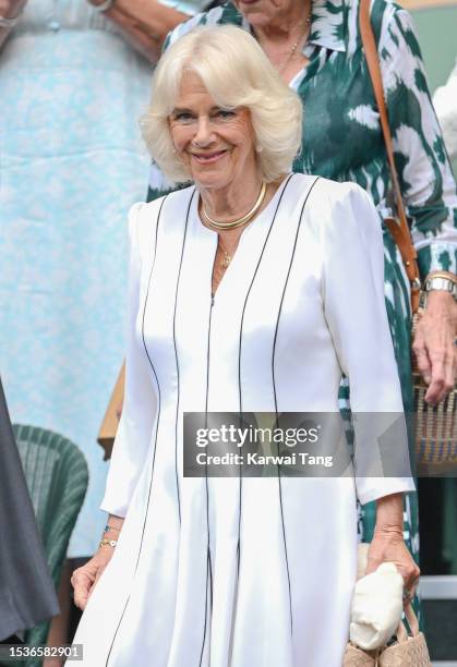 Queen Camilla attends day ten of the Wimbledon Tennis Championships at the All England Lawn Tennis and Croquet Club on July 12, 2023 in London,...