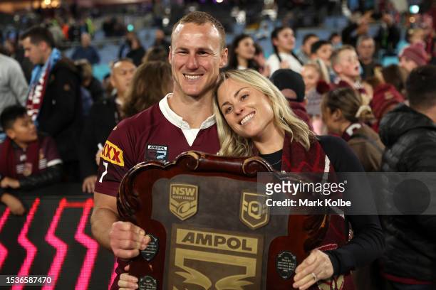 Daly Cherry-Evans of the Maroons poses with his wife Vessa Rockliff as he holds the State of Origin Shield after winning the series 2-1 after game...