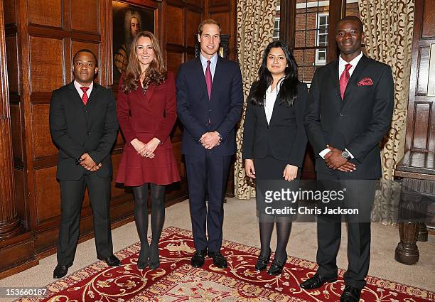 Catherine, Duchess of Cambridge and Prince William, Duke of Cambridge pose with Lasts Year's Diana Scholarship winner Harry Azoh, this year's...