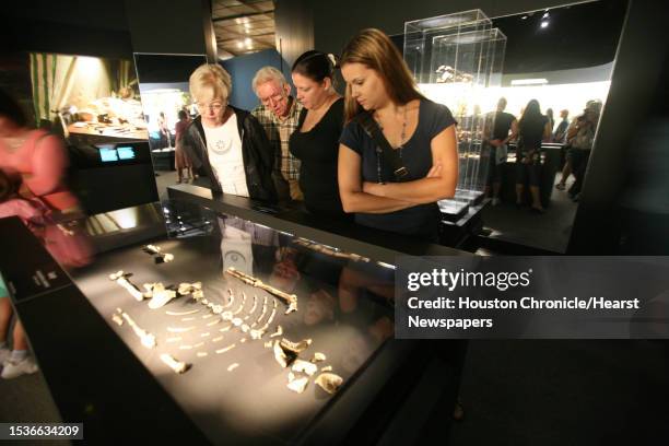 Nancy Starr, Larry Starr, Jennifer Maltos, and Monica Garcia look at the remains of "Lucy". The remains of Lucy, a prehistoric woman who was...