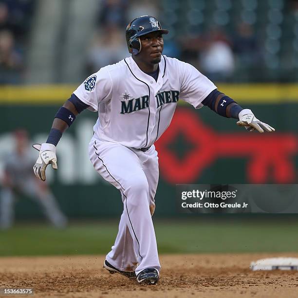 Trayvon Robinson of the Seattle Mariners leads off of second base against the Los Angeles Angels of Anaheim at Safeco Field on October 3, 2012 in...