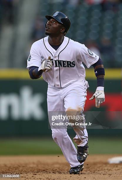 Trayvon Robinson of the Seattle Mariners rounds the bases against the Los Angeles Angels of Anaheim at Safeco Field on October 3, 2012 in Seattle,...