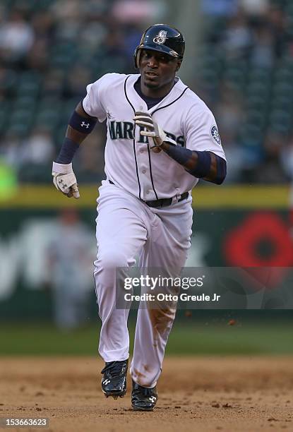 Trayvon Robinson of the Seattle Mariners rounds the bases against the Los Angeles Angels of Anaheim at Safeco Field on October 3, 2012 in Seattle,...