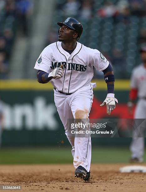 Trayvon Robinson of the Seattle Mariners rounds the bases against the Los Angeles Angels of Anaheim at Safeco Field on October 3, 2012 in Seattle,...