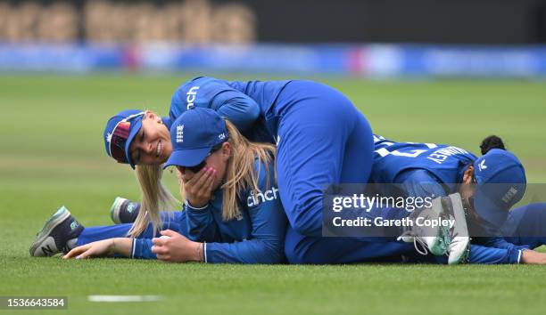 Sophie Ecclestone of England celebrates with Sarah Glenn and Sophia Dunkley after catching out Phoebe Litchfield of Australia during the Women's...