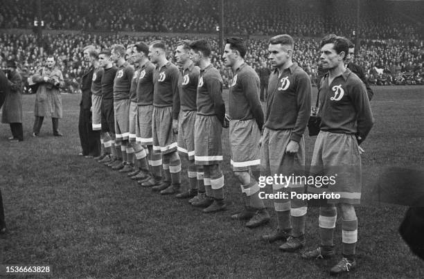 Footballers from the Moscow Dynamo team line up on the pitch before their friendly match with Chelsea FC at Stamford Bridge stadium in London on 13th...