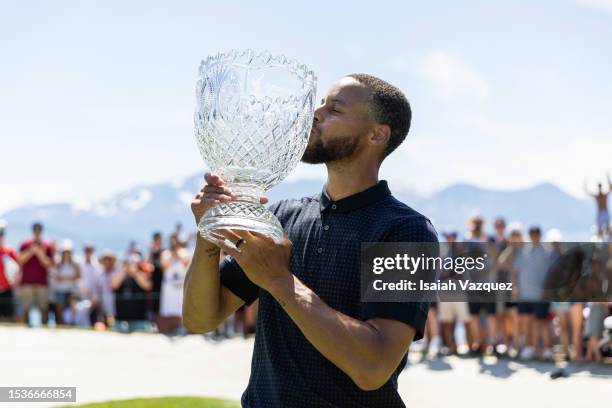 Stephen Curry of the NBA Golden State Warriors kisses his trophy after winning the championship on Day Three of the 2023 American Century...