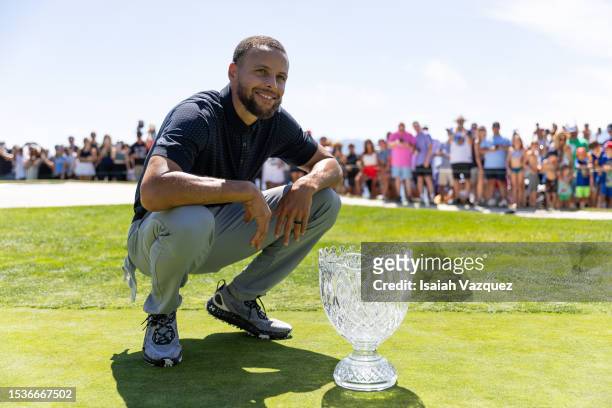 Stephen Curry of the NBA Golden State Warriors looks on with his trophy after winning the championship on Day Three of the 2023 American Century...