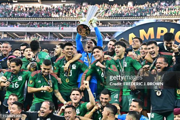 Mexico's goalkeeper Guillermo Ochoa lifts the Concacaf Gold Cup after Mexico won the final football match against Panama at SoFi Stadium in...