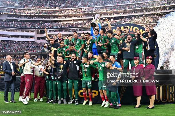 Mexico's goalkeeper Guillermo Ochoa holds up the trophy after Mexico won the Concacaf 2023 Gold Cup final football match against Panama at SoFi...