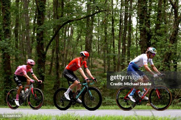 Andrey Amador of Costa Rica and Team EF Education-EasyPost, Matis Louvel of France and Team Arkéa-Samsic and Daniel Oss of Italy and Team...