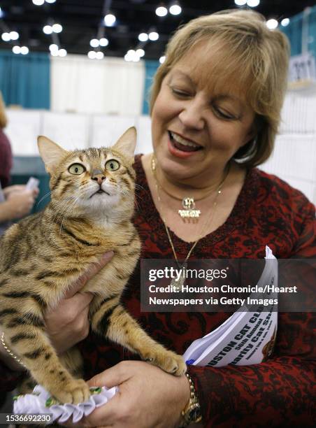 Karen Godwin from Baton Rouge, LA holds "Mo", her Egyptian Mau cat at the Houston Cat Club's 56th Annual Charity Cat Show at the George R. Brown...