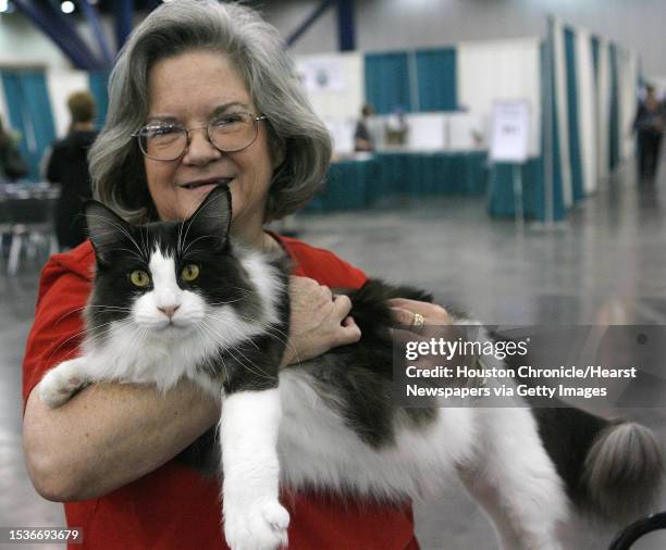 Karen Crooke of Beaumont, TX holds "Smokin in the Back Room", her Main Coon cat at the Houston Cat Club's 56th Annual Charity Cat Show at the George...