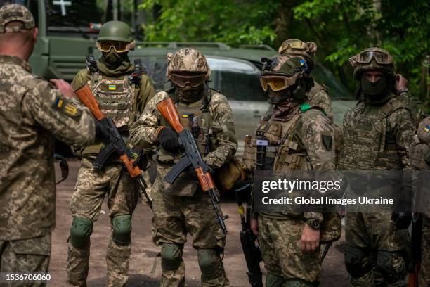 Ukrainian soldiers stand before the start of airsoft exercises on May 23, 2023 in Donetsk Oblast, Ukraine. With the help of airsoft, soldiers...