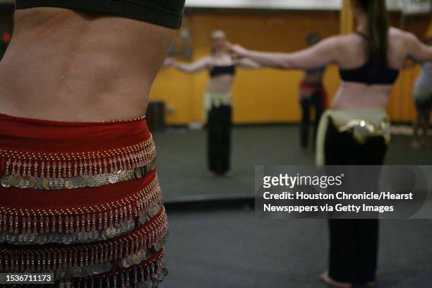 Cheryl Anderson, participates in a "Hot" belly dancing class taught by Talina Grimes . Hot belly dancing combines the heat of Bikram yoga with dance...