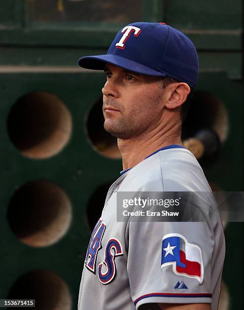 Michael Young of the Texas Rangers stands in the dugout before their game against the Oakland Athletics at O.co Coliseum on October 2, 2012 in...