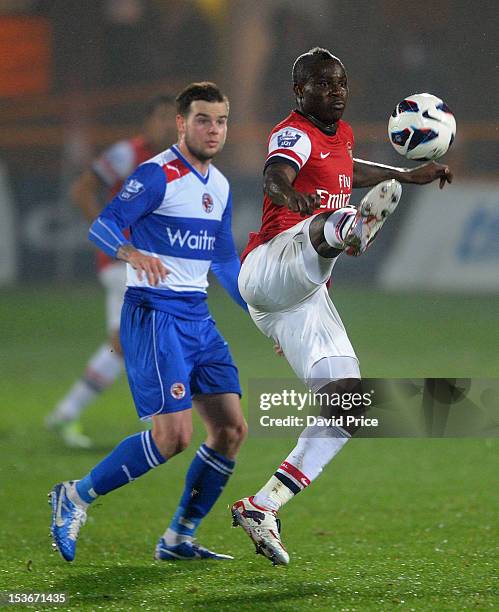 Emmanuel Frimpong of Arsenal controls the ball under pressure from Danny Guthrie of Reading during the Barclays Premier U21 match between Arsenal U21...