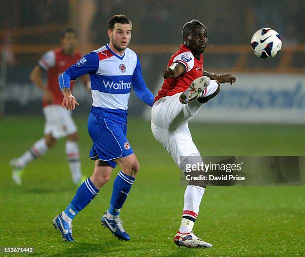 Emmanuel Frimpong of Arsenal controls the ball under pressure from Danny Guthrie of Reading during the Barclays Premier U21 match between Arsenal U21...
