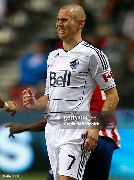Sebastien Le Toux of the Vancouver Whitecaps FC winces in pain after a collision during their MLS game against Chivas USA October 3, 2012 at BC Place...
