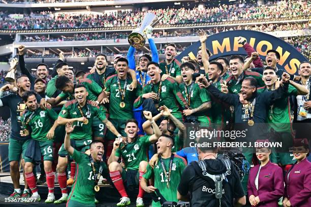 Mexico's goalkeeper Guillermo Ochoa holds up the trophy as he and teammates celebrate after Mexico won the Concacaf 2023 Gold Cup final football...