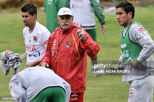 The coach of Bolivia's national football team, Spaniard Xabier Azcargorta gives directions to the players during a training session in La Paz on...