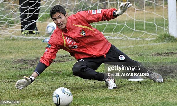 Bolivia's national football team goalkeeper Carlos Arias, eyes the ball during a training session in La Paz on October 8, 2012. Bolivia will face...