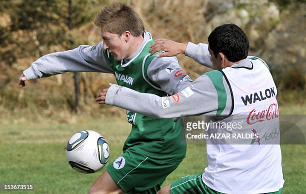 Bolivia's national football players Alejandro Chumacero and Walter Flores vie during a training session in La Paz on October 8, 2012. Bolivia will...