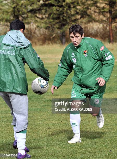 Bolivia's national football player Ronald Raldes eyes the ball during a training session in La Paz on October 8, 2012. Bolivia will face Peru in a...
