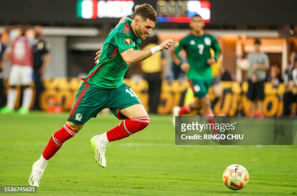 Mexico's forward Santiago Gimenez drives the ball to score during the Concacaf 2023 Gold Cup final football match between Mexico and Panama at SoFi...