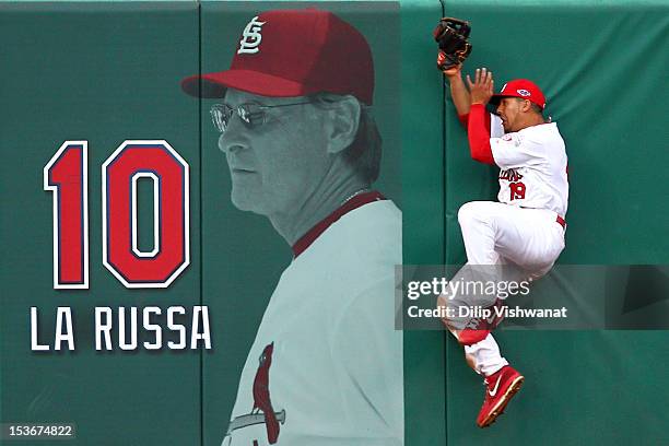 Jon Jay of the St. Louis Cardinals makes a catch against the wall on a ball hit by Danny Espinosa of the Washington Nationals in the sixth inning...