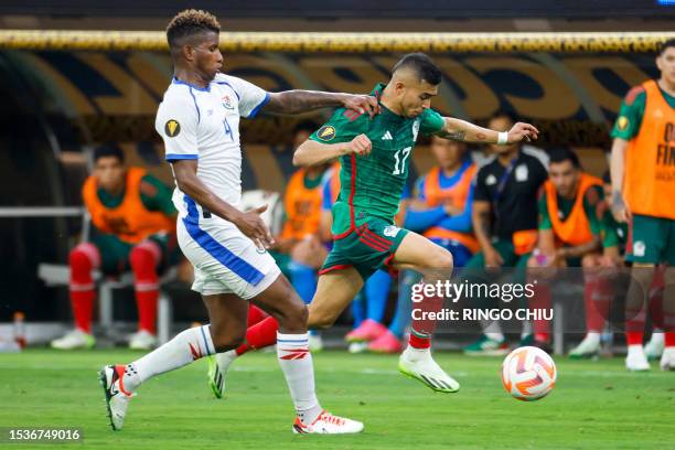 Panama's defender Fidel Escobar and Mexico's midfielder Orbelin Pineda vie for the ball during the Concacaf 2023 Gold Cup final football match...