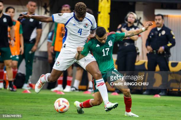 Panama's defender Fidel Escobar and Mexico's midfielder Orbelin Pineda vie for the ball during the Concacaf 2023 Gold Cup final football match...