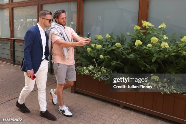 Spectator takes a selfie with former footballer, Jack Wilshire during day ten of The Championships Wimbledon 2023 at All England Lawn Tennis and...