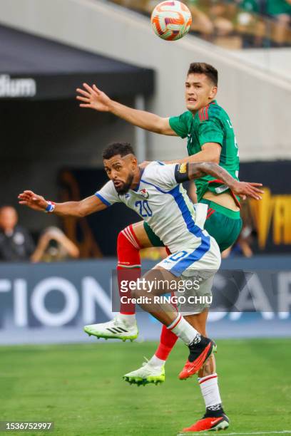 Panama's midfielder Anibal Godoy vies for the ball with Mexico's defender Cesar Montes during the Concacaf 2023 Gold Cup final football match between...