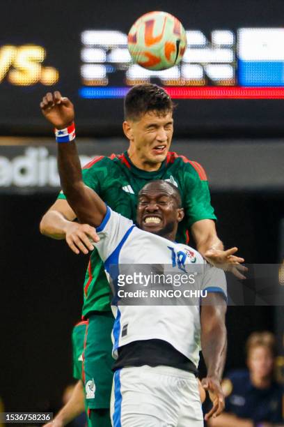Mexico's defender Luis Romo and Panama's forward Cecilio Waterman jump to head the ball during the Concacaf 2023 Gold Cup final football match...