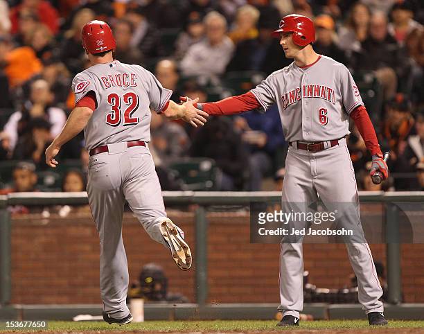 Drew Stubbs of the Cincinnati Reds celebrates with teammate Jay Bruce during Game 2 of the NLDS against the San Francisco Giants at AT&T Park on...