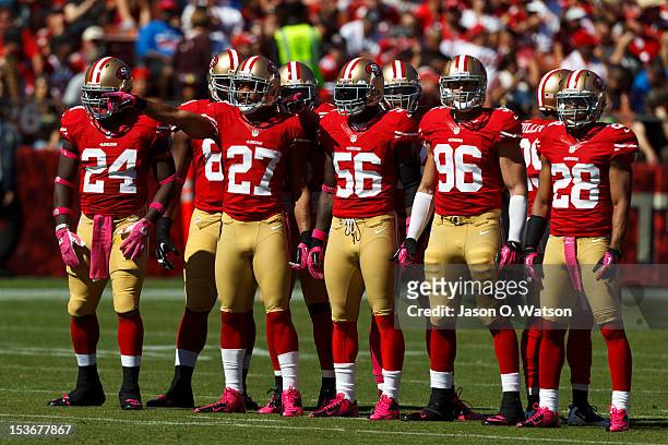 Anthony Dixon of the San Francisco 49ers, C.J. Spillman, Tavares Gooden, Eric Bakhtiari, and Darcel McBath line up for a kick off against the Buffalo...
