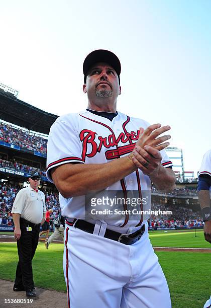 Manager Fredi Gonzalez of the Atlanta Braves heads to the dugout before the National League Wild Card Game against the St. Louis Cardinals at Turner...