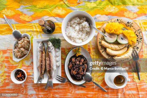 table set outdoors with fresh fish dishes - philippines stock pictures, royalty-free photos & images