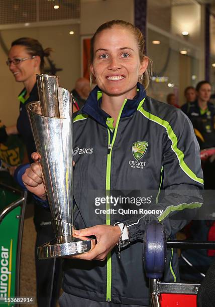 Jodie Fields of the Southern Stars poses with the trophy after arriving back home to Australia after winning the 2012 ICC Women's T20 World Cup, at...