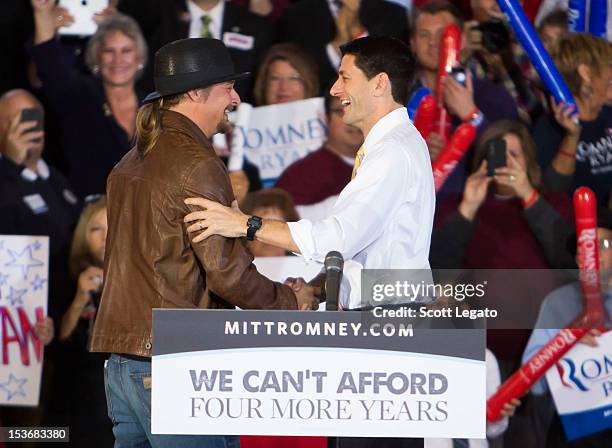 Kid Rock and Congressman Paul Ryan attends the Congressman Paul Ryan Rally With Kid Rock at Oakland University Athletic Center on October 8, 2012 in...